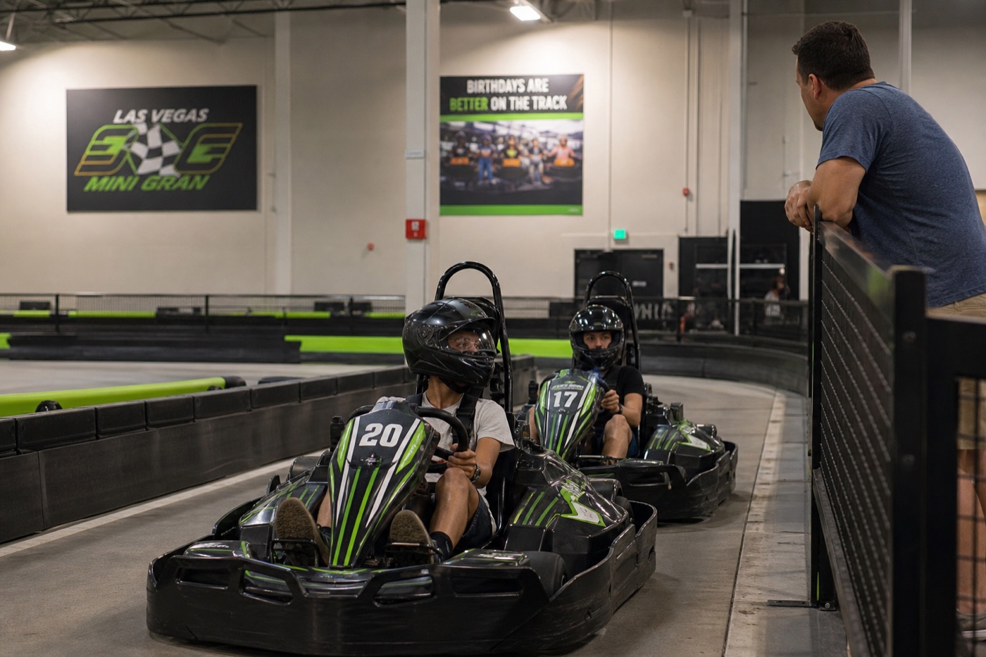 Teens in helmets getting ready for indoor go kart racing in Las Vegas